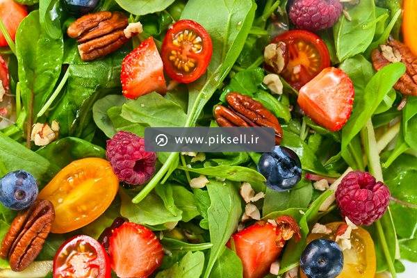 عکس با کیفیت از سالاد اسفناج و گردو یا سالاد رژیمی