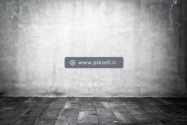 عکس با کیفیت از پس زمینه دیوار بتنی و کف پارکت