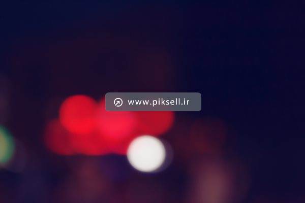 عکس با کیفیت از پس زمینه تار با چرغ های قرمز (بکگراند بلور)