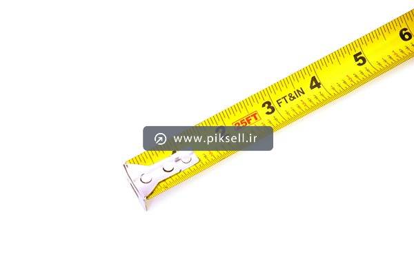 عکس با کیفیت از متر فلزی زرد با فرمت jpg