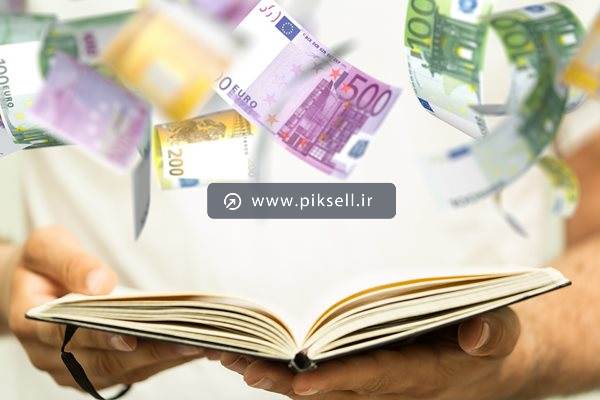 دانلود عکس با کیفیت از کتاب باز شده و اسکناس های کاغذی در هوا